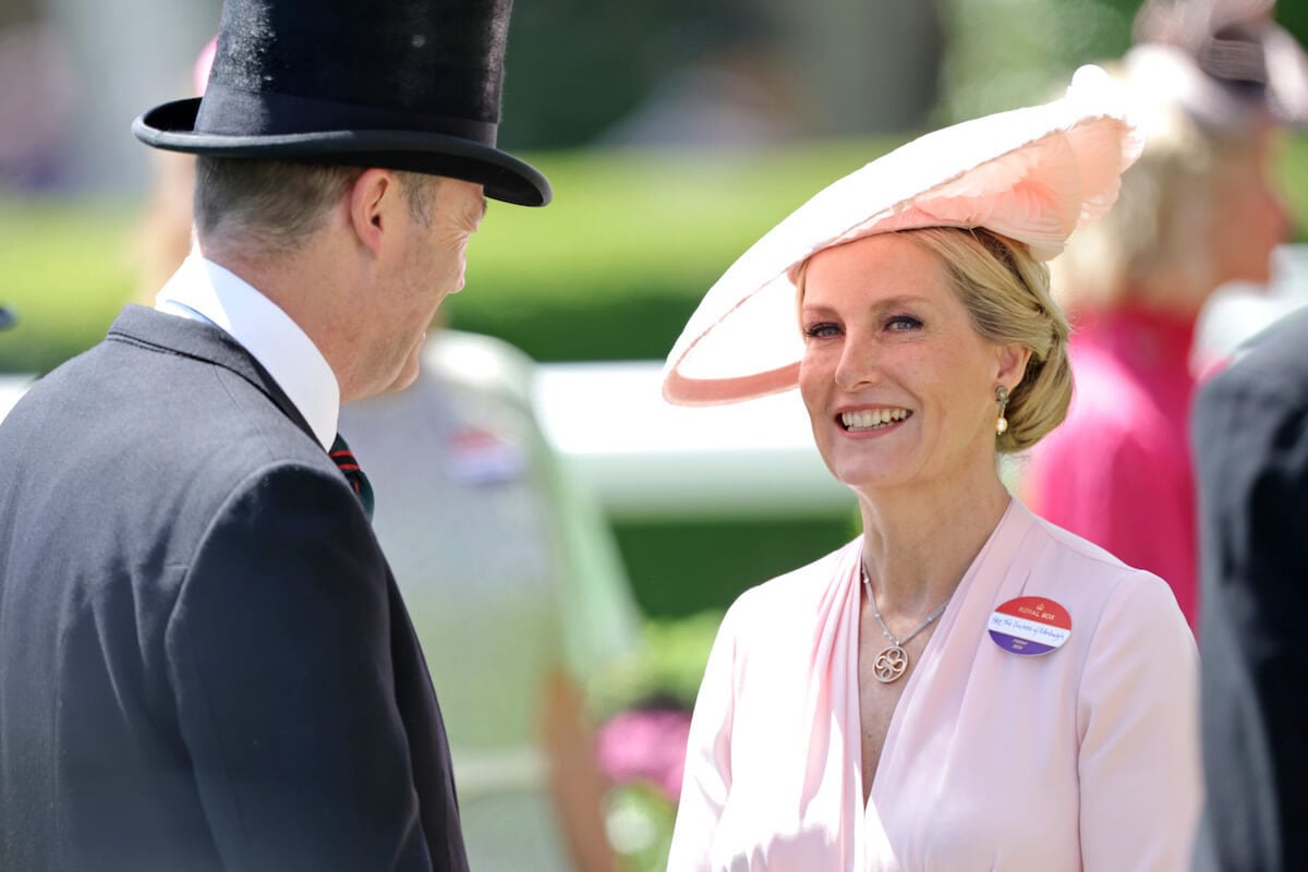 Sophie, Duchess of Edinburgh, who a commentator calls one of the royal family's 'stars' looks on wearing a pink top and hat