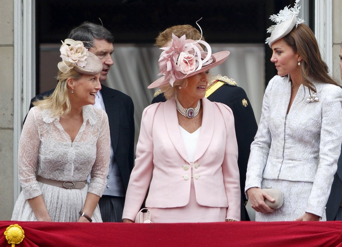 Sophie (now the Duchess of Edinburgh, who a body language expert says has 'a knack for fitting in,' standing on the Buckingham Palace balcony with Camilla Parker Bowles and Kate Middleton