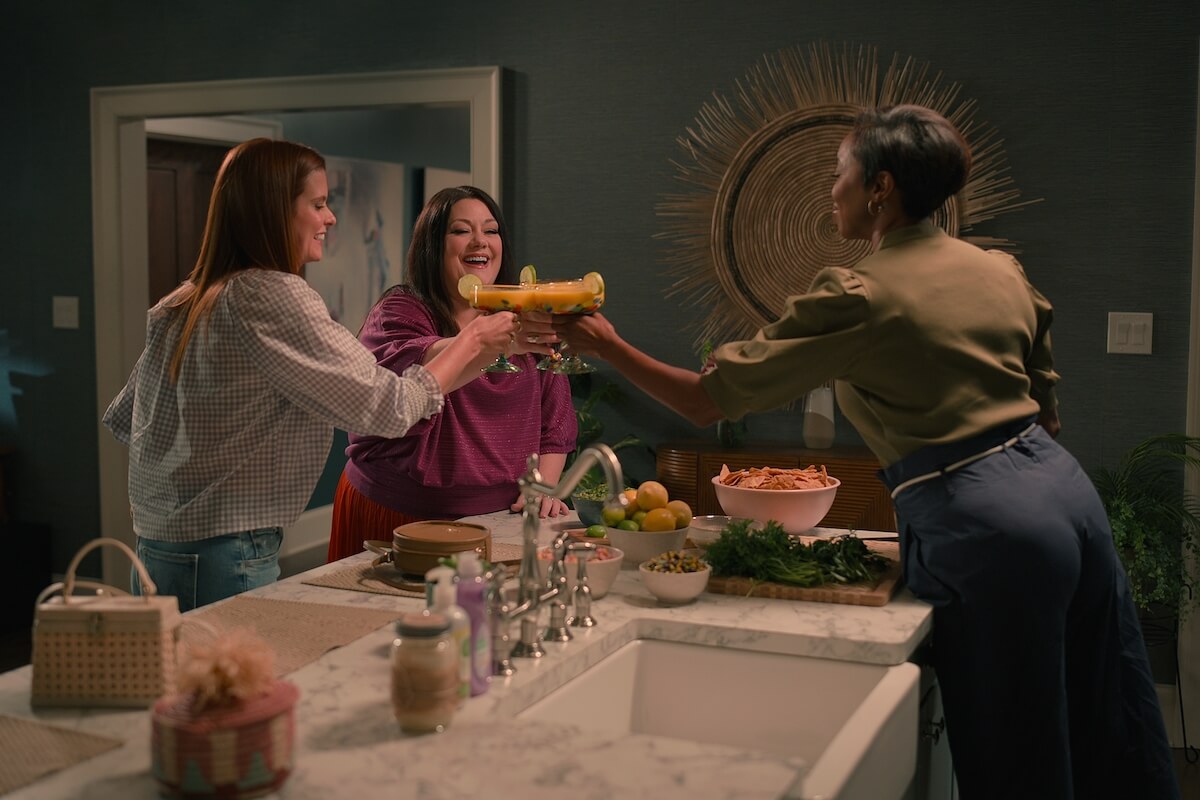 Maddie, Dana Sue, and Helen toasting with margarita glasses in 'Sweet Magnolias' Season 3