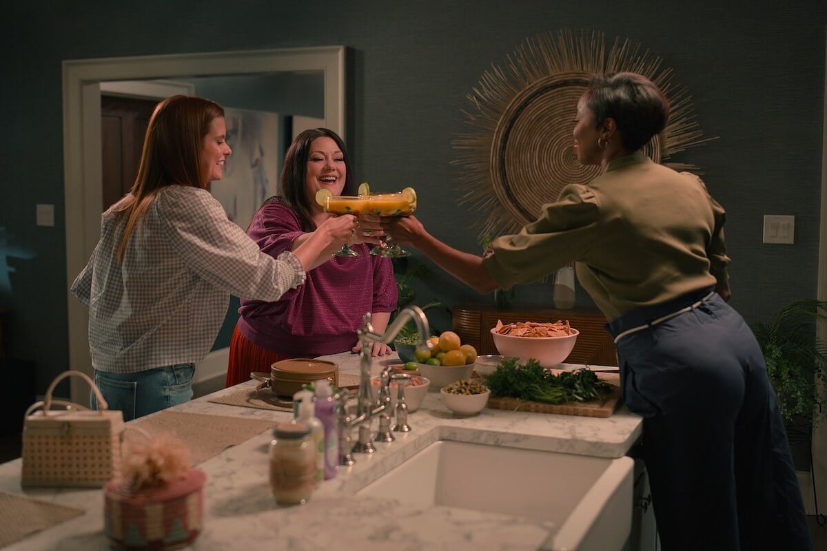 Maddie, Dana Sue, and Helen toasting with margarita glasses in 'Sweet Magnolias' Season 3, one of several shows like 'Virgin River' on Netflix.