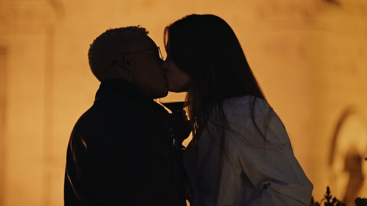Silhouetted Ash and Jess kissing in 'Swiping America'