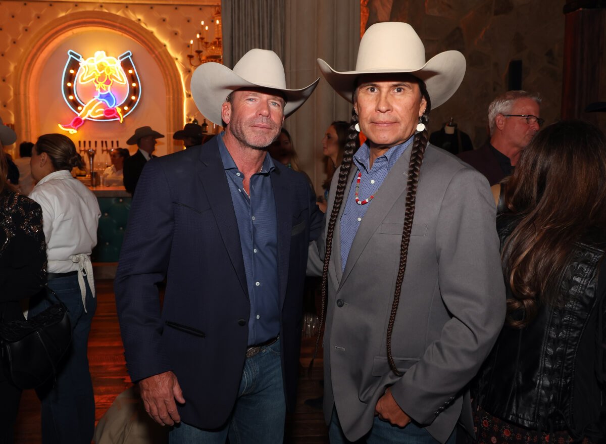 Taylor Sheridan and Mo Brings Plenty attend the premiere for Paramount Network's "Yellowstone" Season 5 at Hotel Drover on November 13, 2022 in Fort Worth, Texas