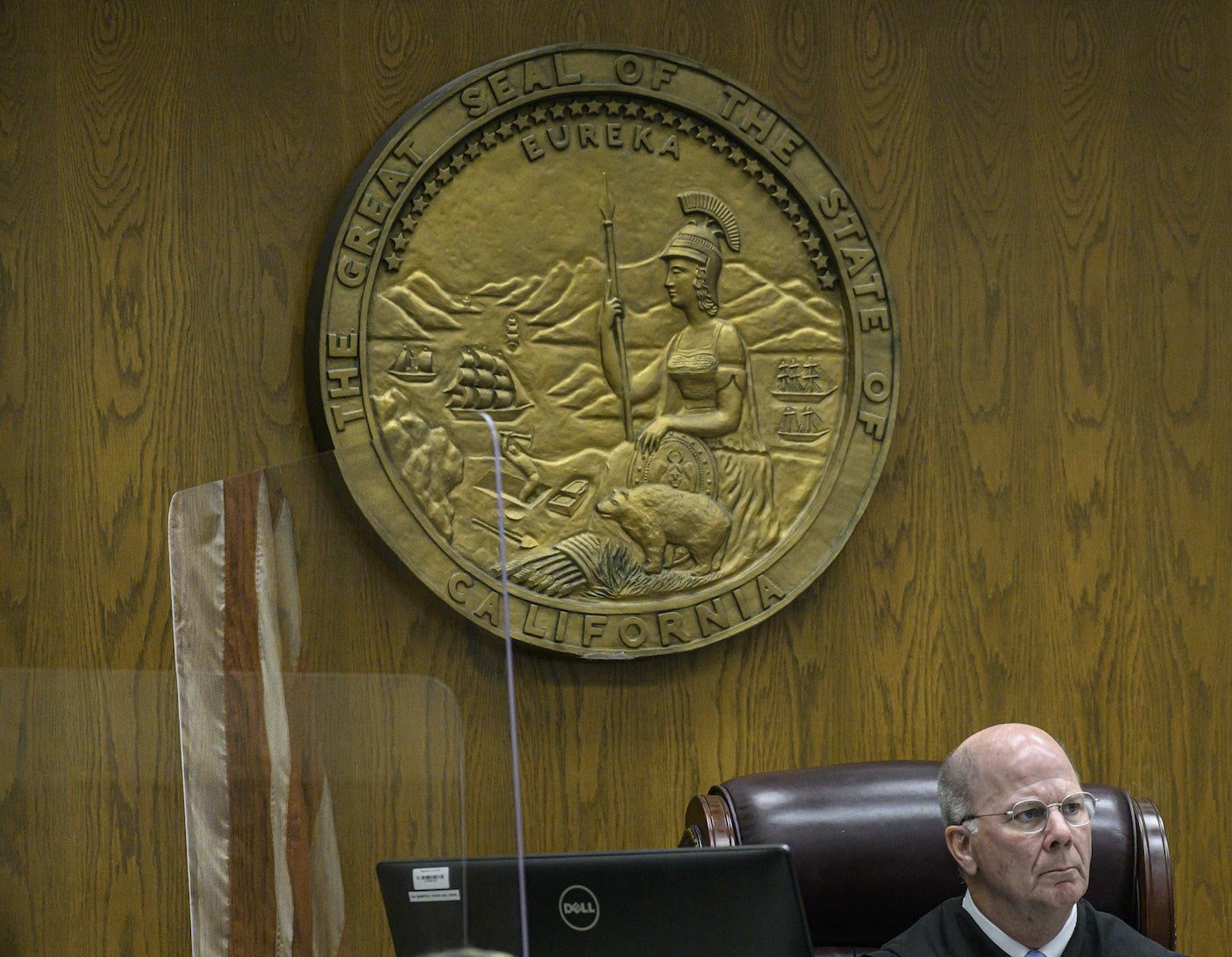 Judge Gregg L. Prickett sits in front of the California seal during Wendi Miller's murder trial