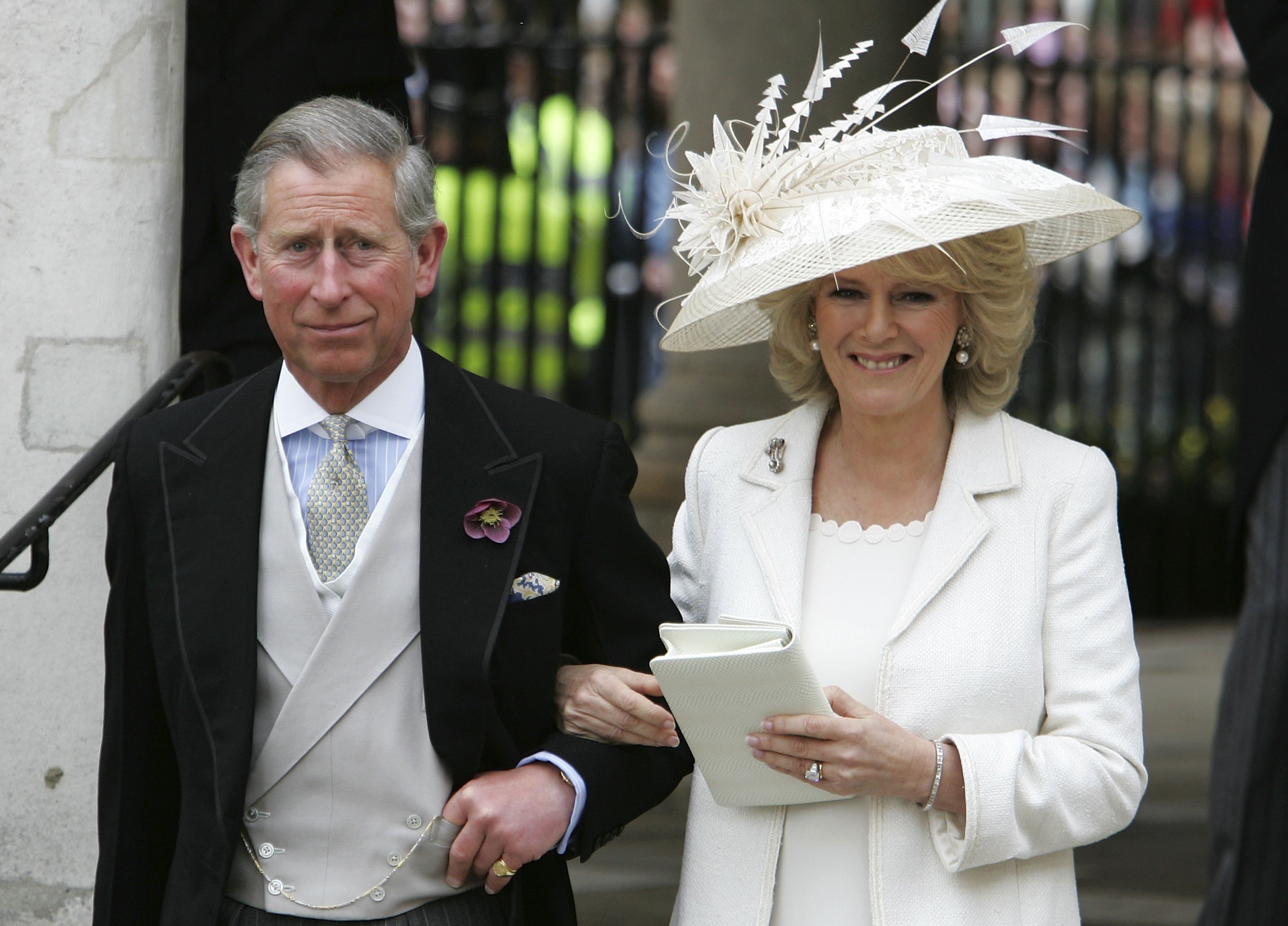 Then-Prince Charles and Camilla Parker Bowles, who refused to wear a tiara on her wedding day, depart the civil ceremony where they were legally married at The Guildhall, Windsor