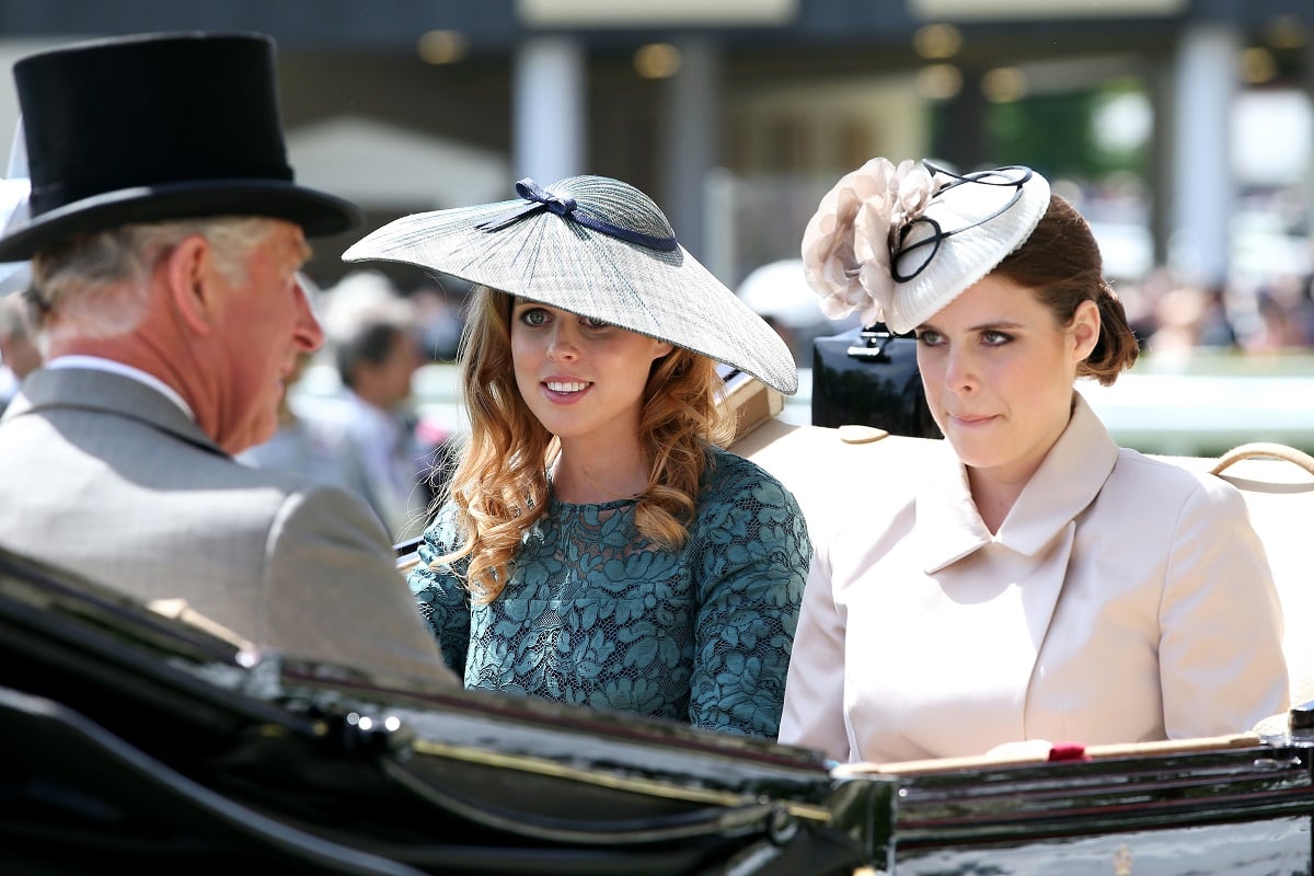 Then-Prince Charles in carriage with Princess Beatrice and Princess Eugenie on day one of Royal Ascot