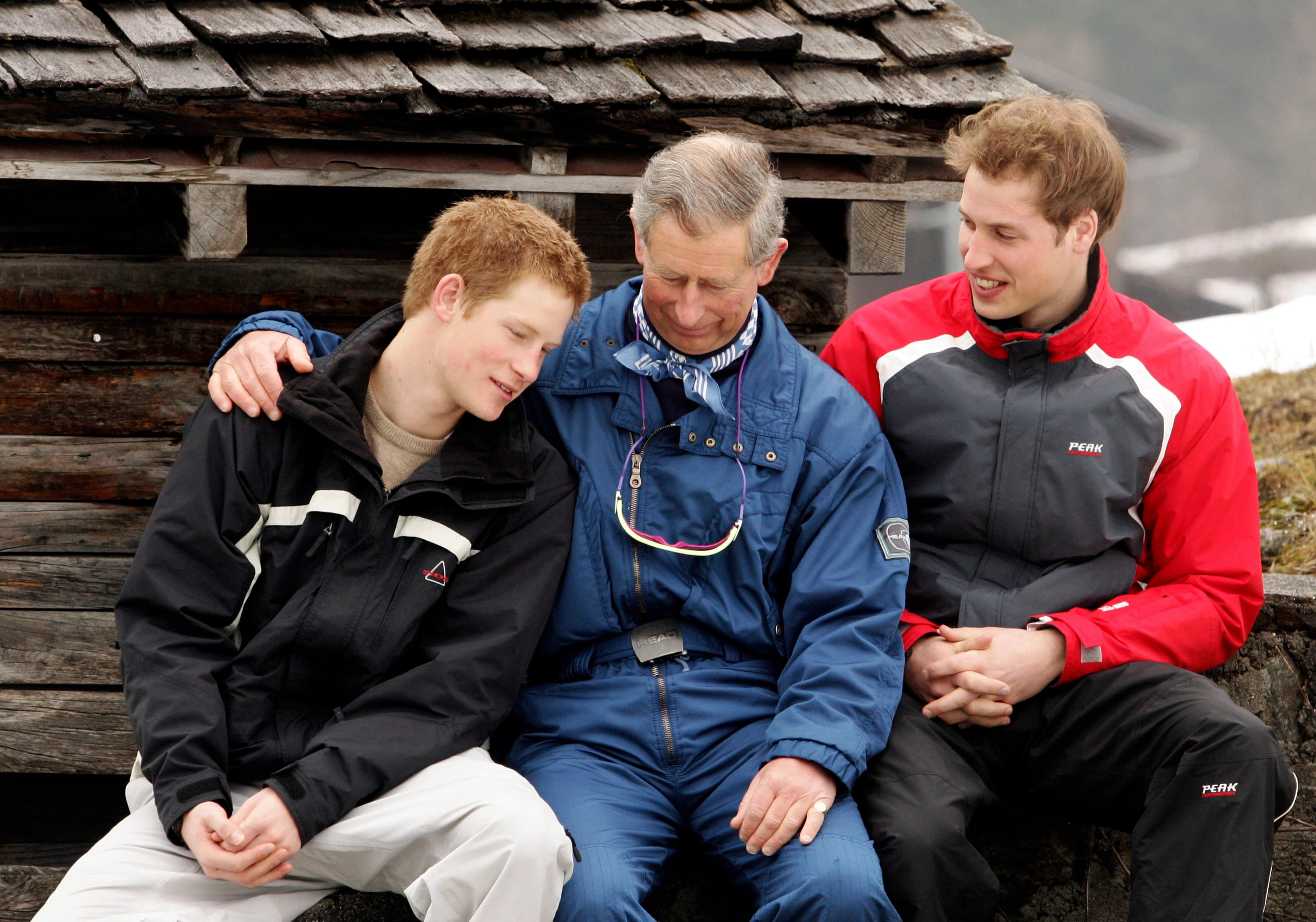 Then-Prince Charles poses with his sons Prince William and Prince Harry during the Royal Family's ski break at Klosters