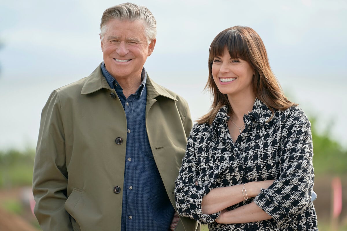 Treat Williams standing next to Meghan Ory in a scene from Hallmark Channel's 'Chesapeake Shores'