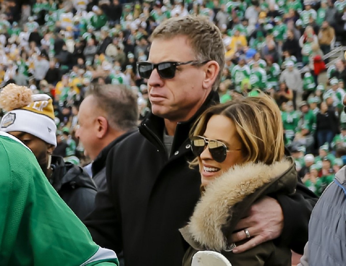 Troy Aikman, who is more than 20 years older than his rumored new girlfriend, hugging his second wife Capa Mooty prior to a Dallas Stars game