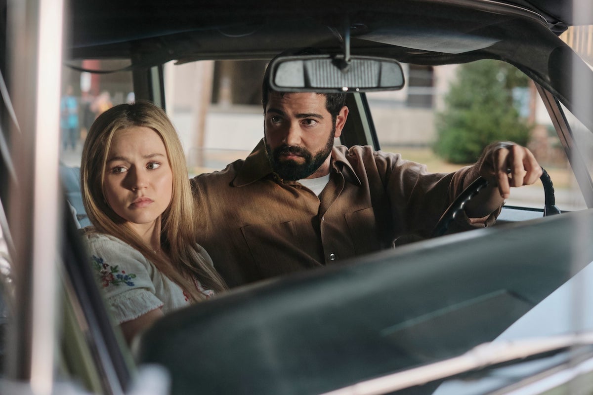 Brec Bassinger and Jesse Metcalfe sitting in a car in 'V.C. Andrews' Dawn' on Lifetime