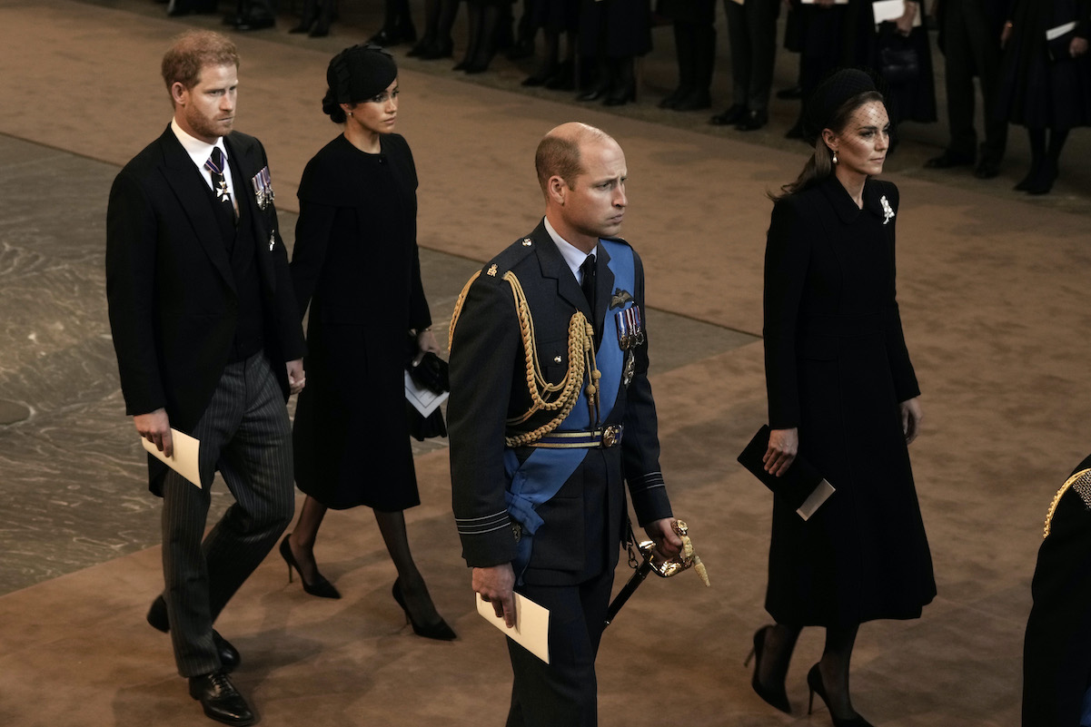 Prince Harry, Meghan Markle, Prince William, and Kate Middleton at the queen's lying in state ceremony in 2022