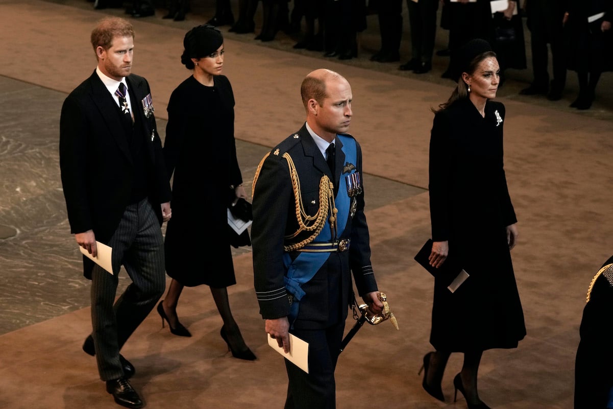 Prince Harry, Meghan Markle, Prince William, and Kate Middleton at the queen's lying in state ceremony in 2022