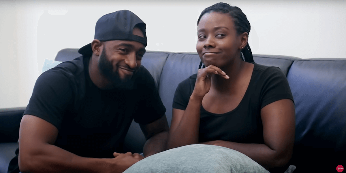 Woody Randall and Amani Aliyya from 'Married at First Sight' Season 11 sitting on a couch