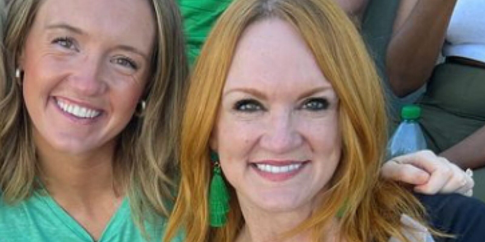 Alex and Ree Drummond pose in a photo taken at a football game.