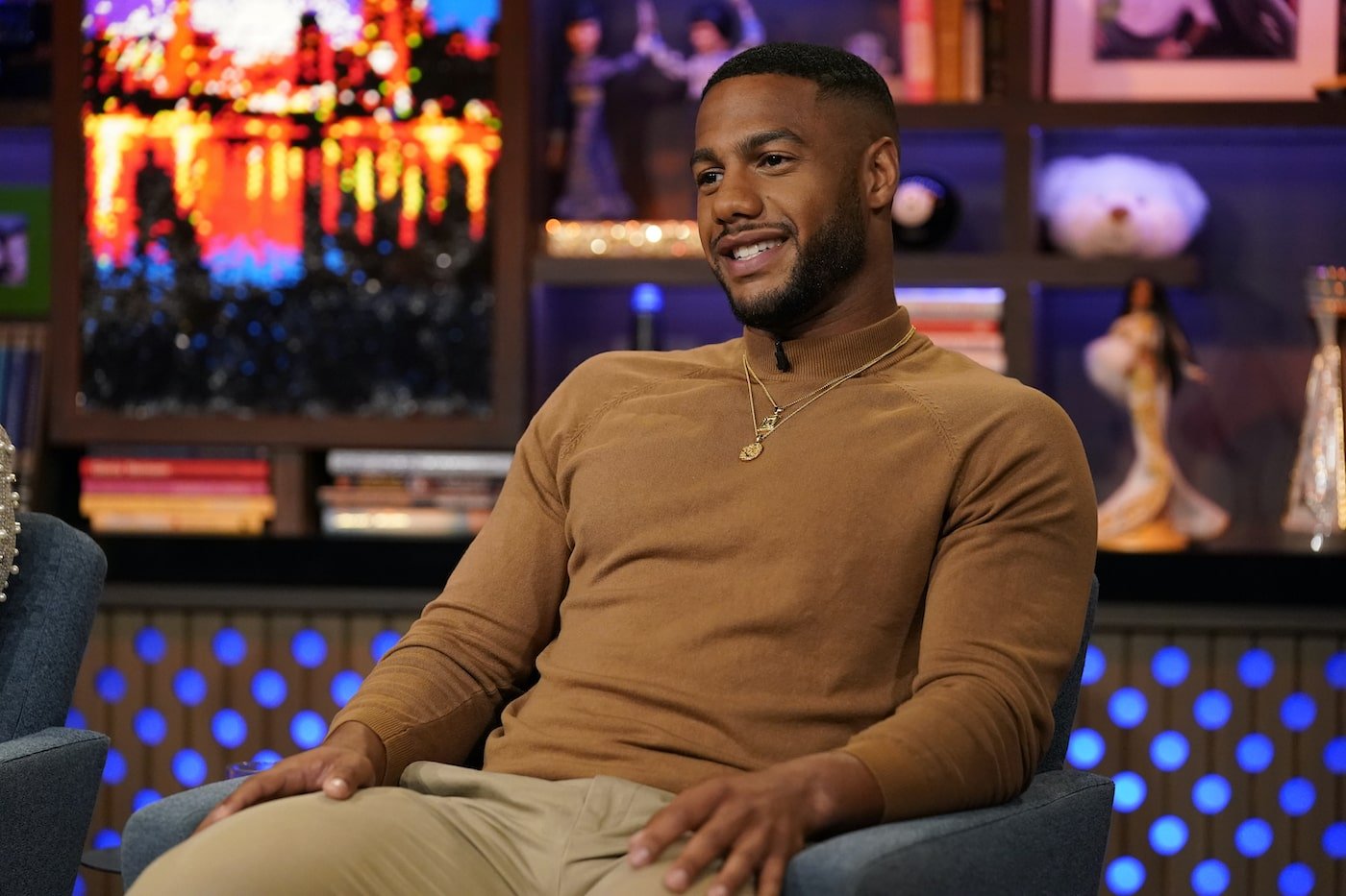 Amir Lancaster sits in a chair at 'WWHL'