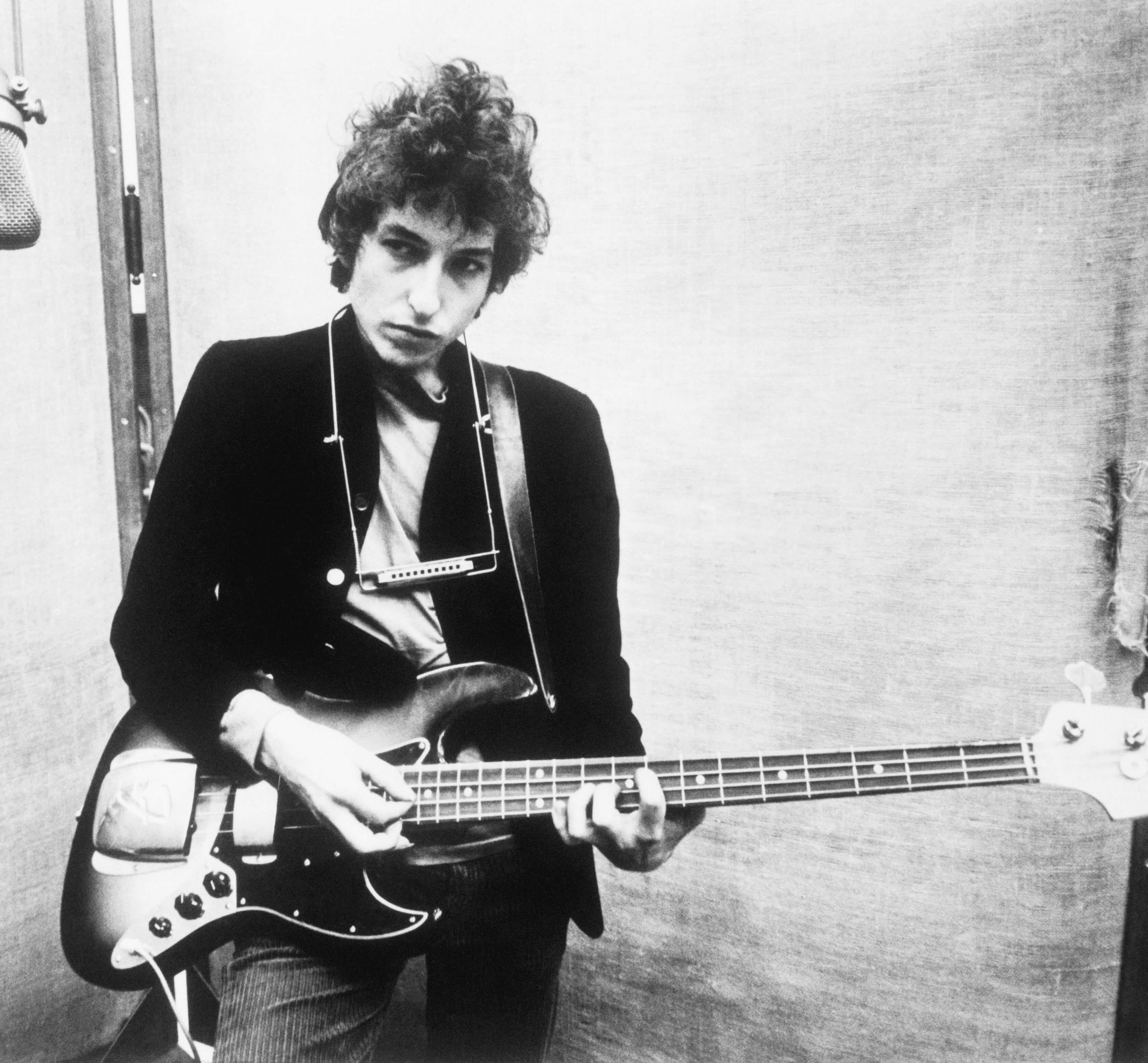 Bob Dylan holding a guitar