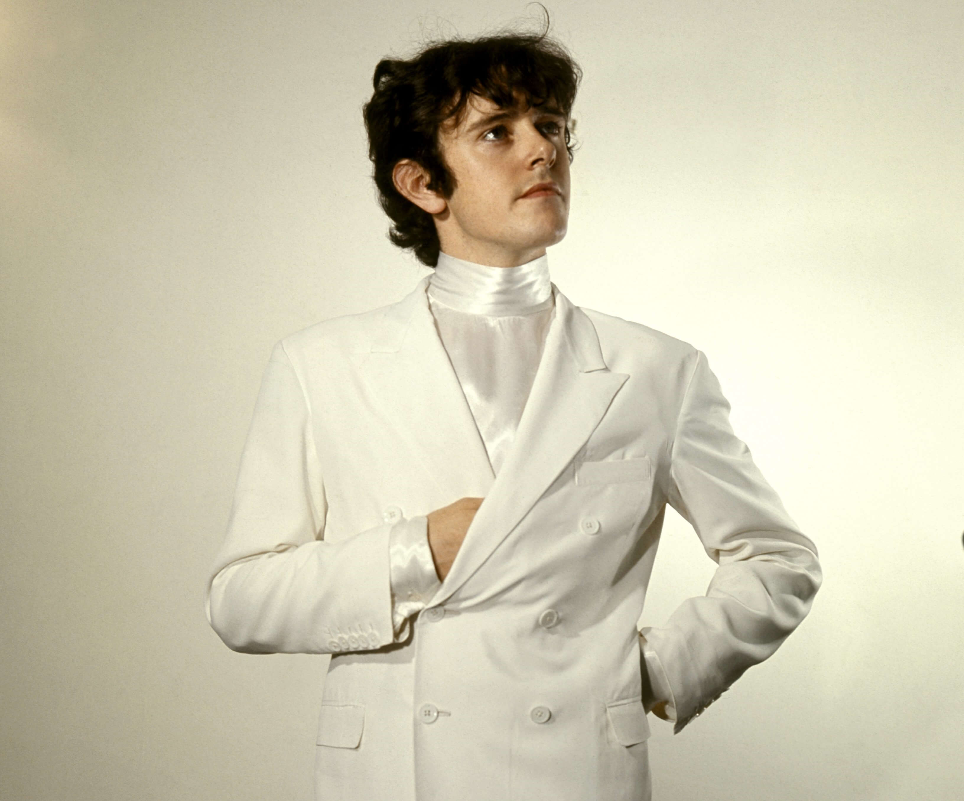 "Atlantis" singer Donovan in a white suit jacket