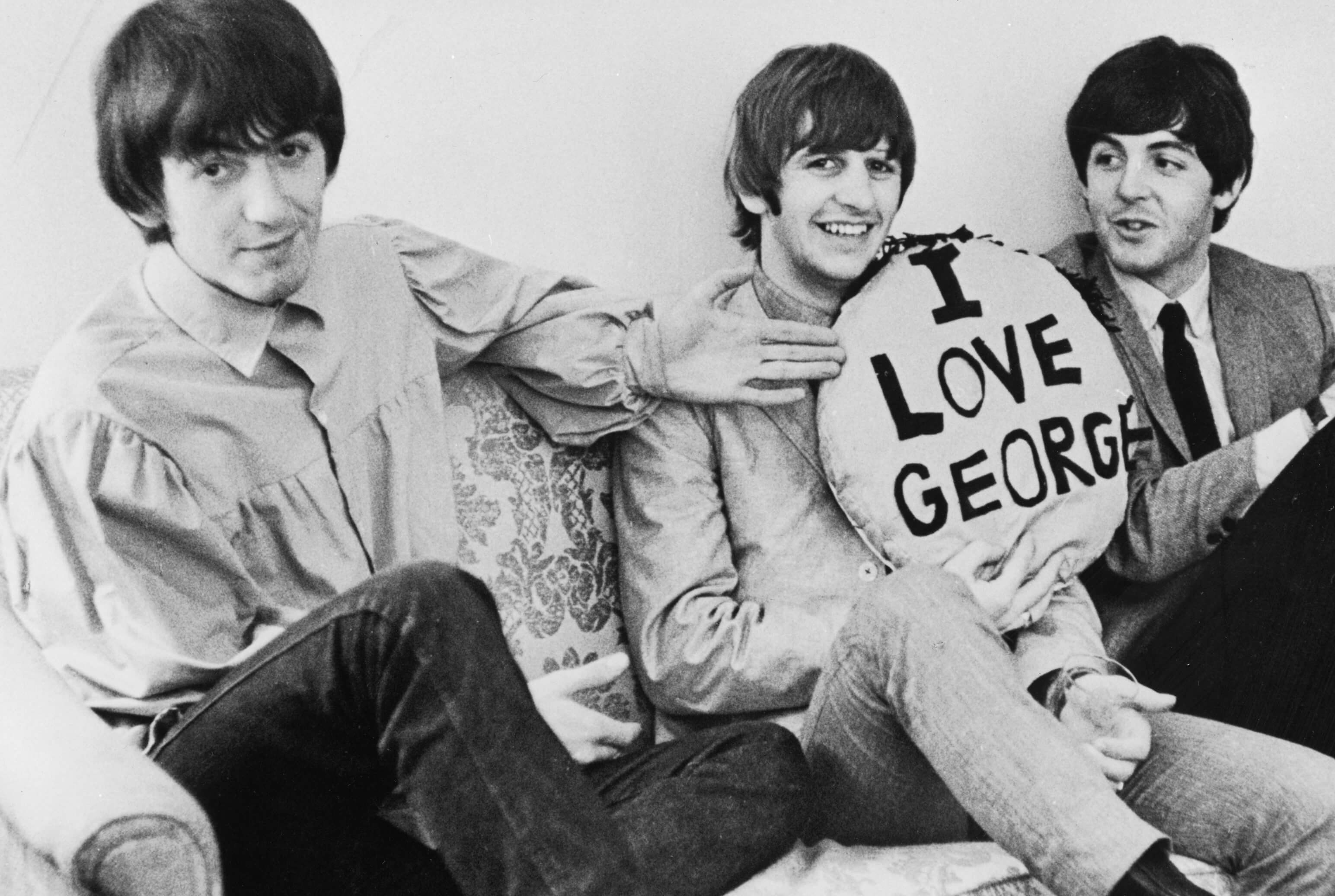 George Harrison, Ringo Starr, and Paul McCartney on a couch