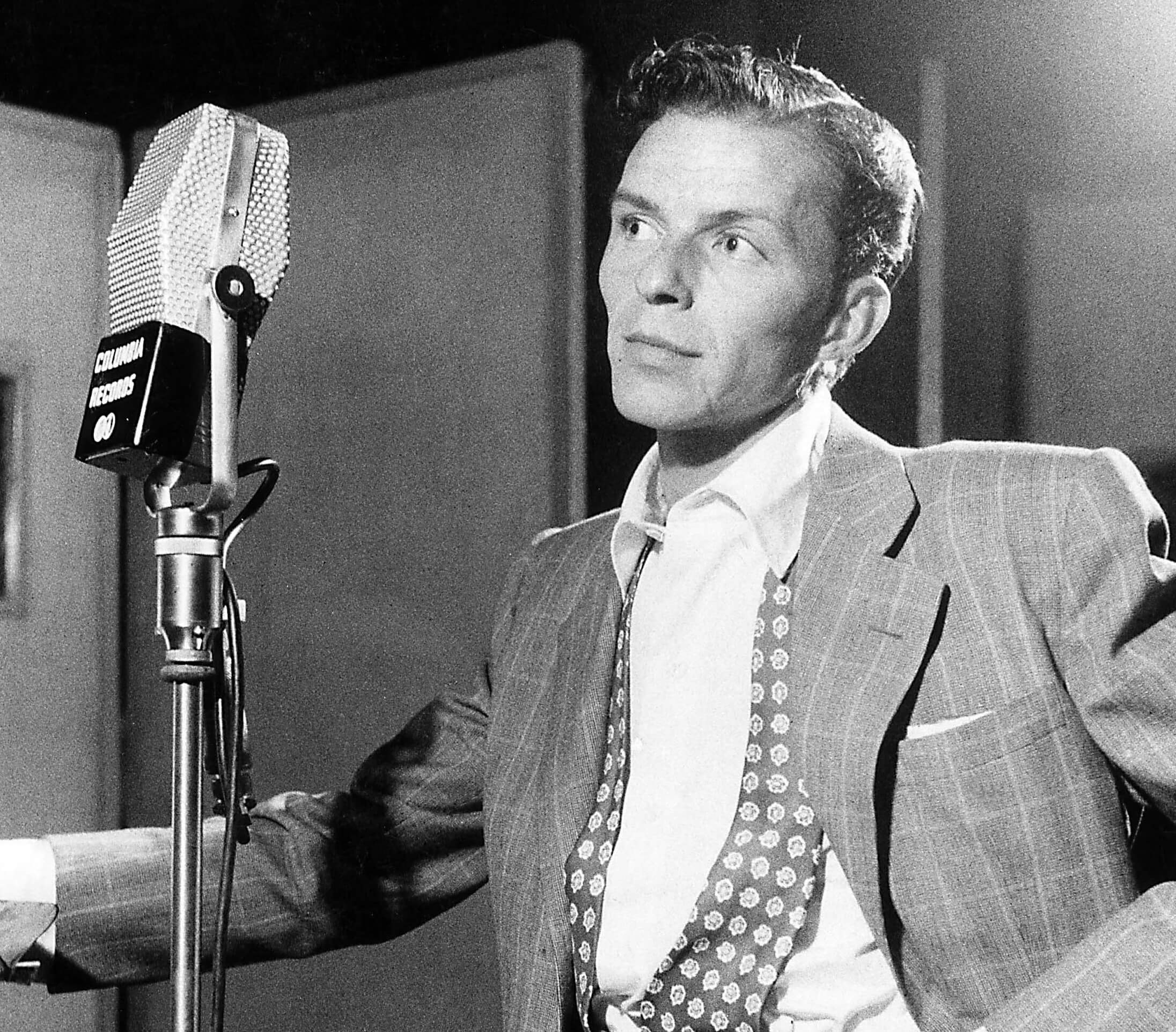 "That's Life" singer Frank Sinatra near a microphone