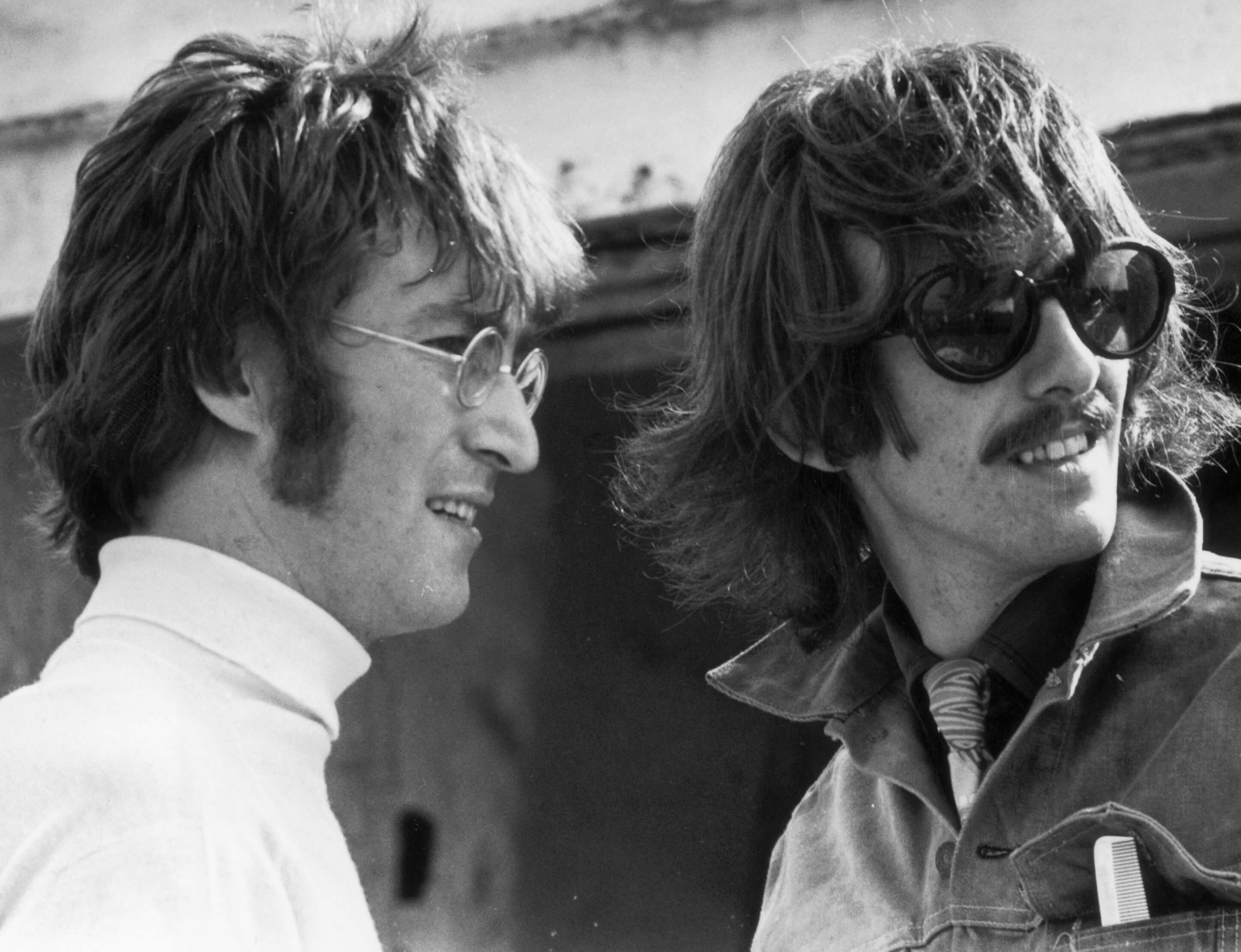 John Lennon and George Harrison in black-and-white