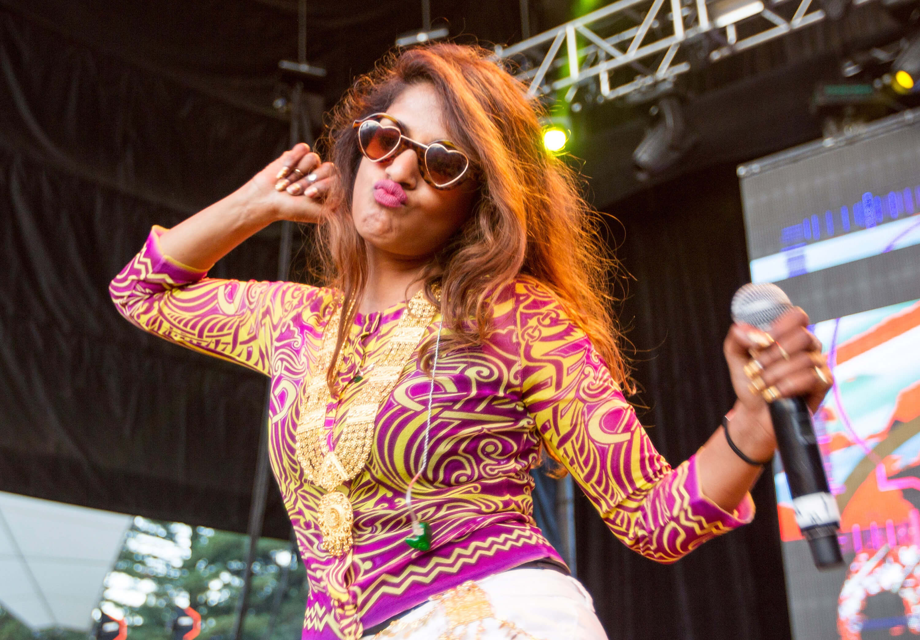 M.I.A. wearing heart-shaped glasses