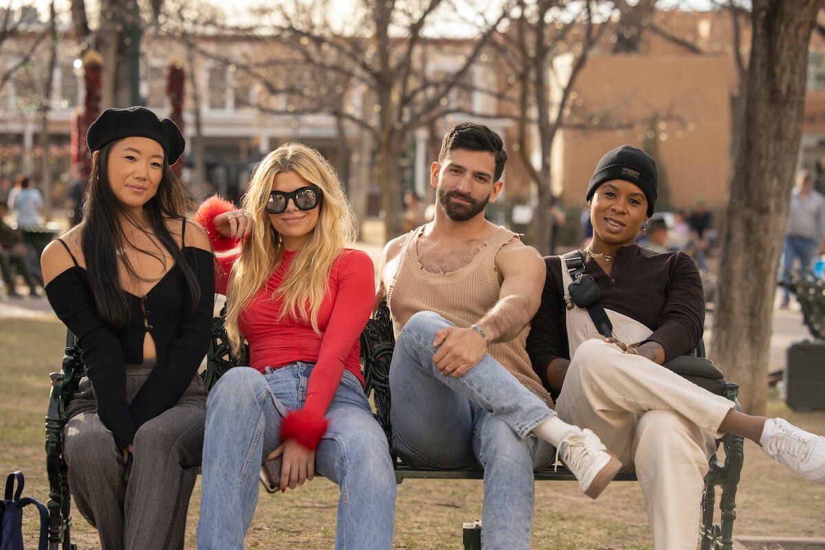 The cast of Max's 'Swiping America' sitting on a bench