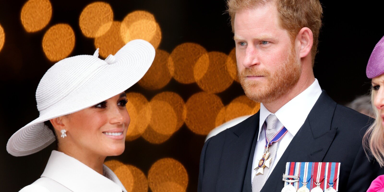 Meghan Markle and Prince Harry pose at a the platinum jubilee of Queen Elizabeth in 2022.