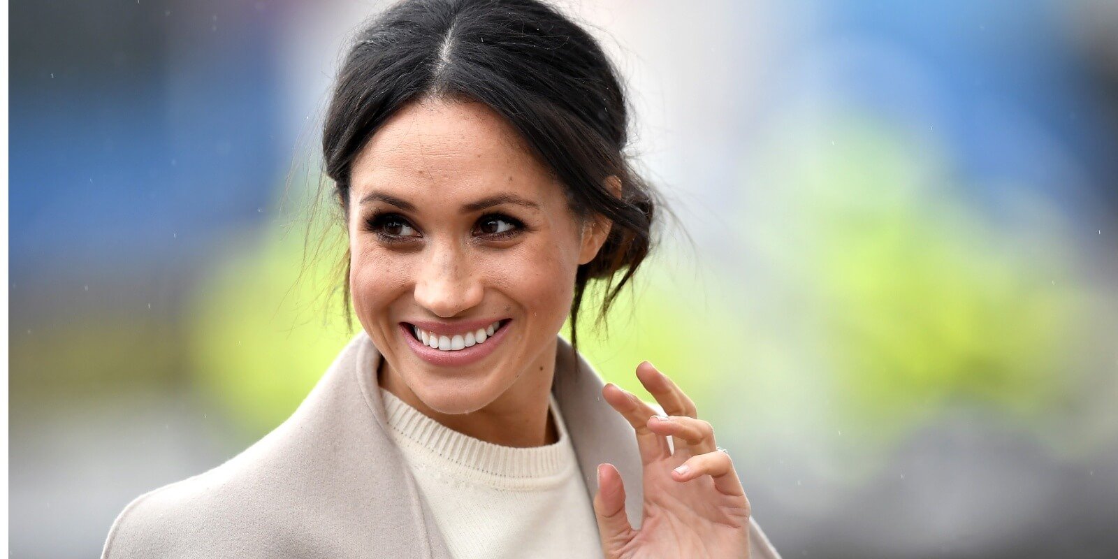 Meghan Markle waves to onlookers in 2018.