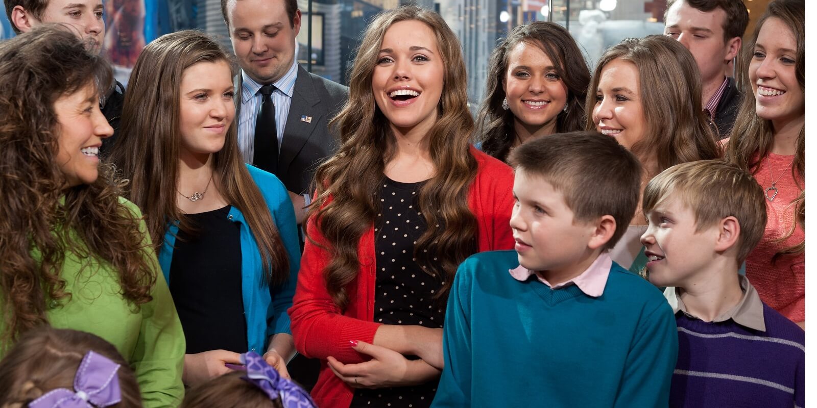 Michelle Duggar and the Duggar family pose together during an appearance on the television series 'Extra' in 2014.