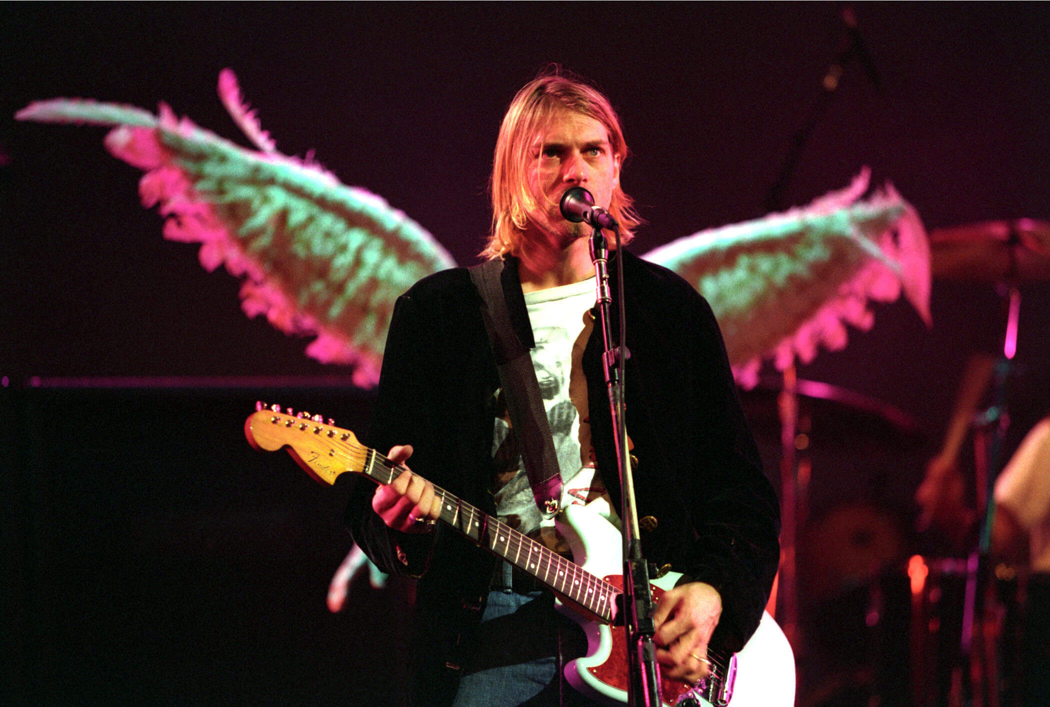 Kurt Cobain with a guitar during Nirvana's "Smells Like Teen Spirit" era