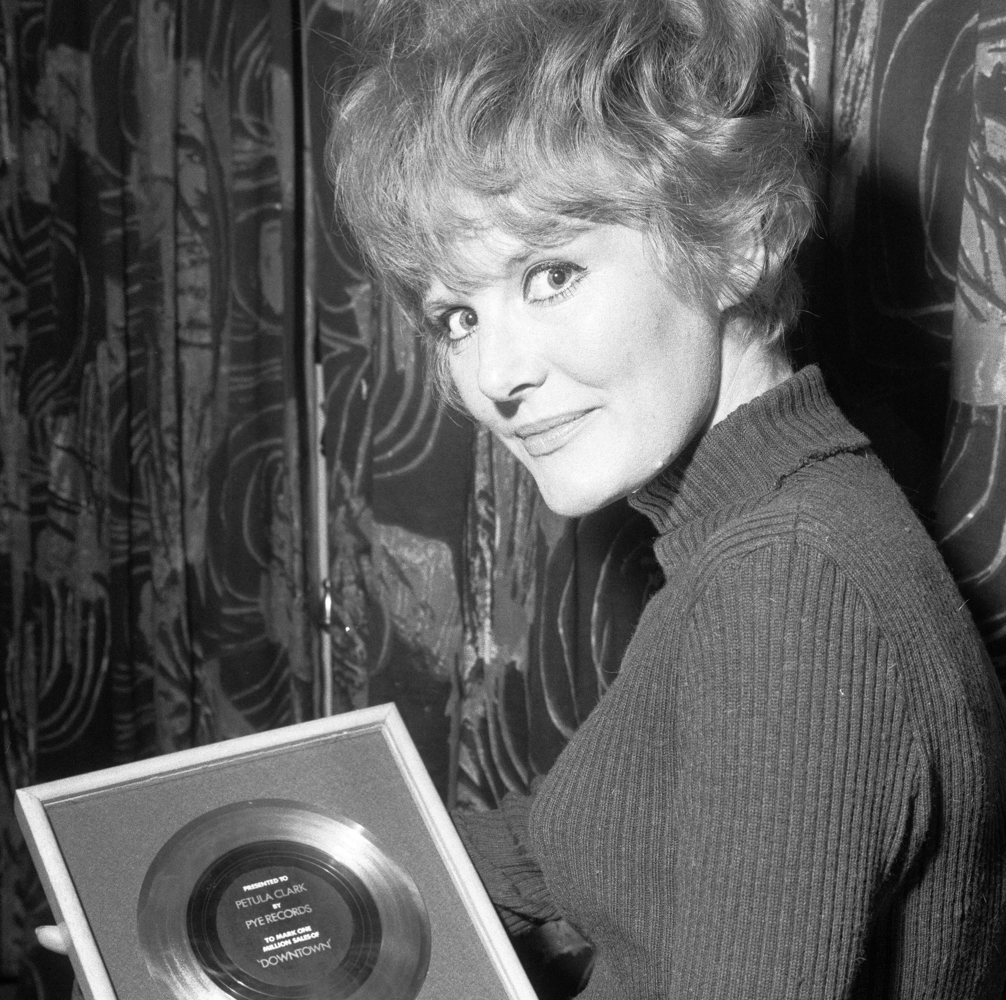 "Don't Sleep in the Subway" singer Petula Clark holding a record