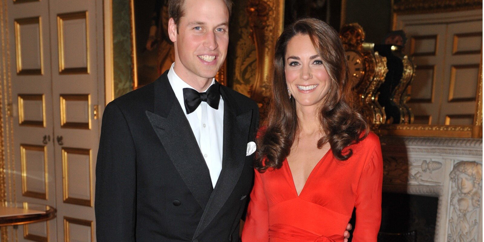 Prince William and Kate Middleton photographed at an event in 2011 where she wore a red, low-cut dress.