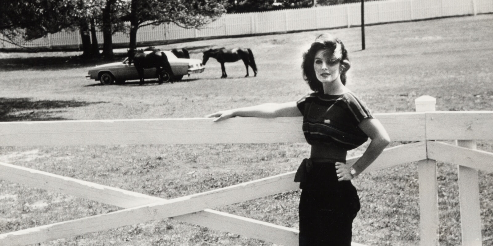 Priscilla Presley poses on the grounds of Graceland near the stables in the early 1980s.
