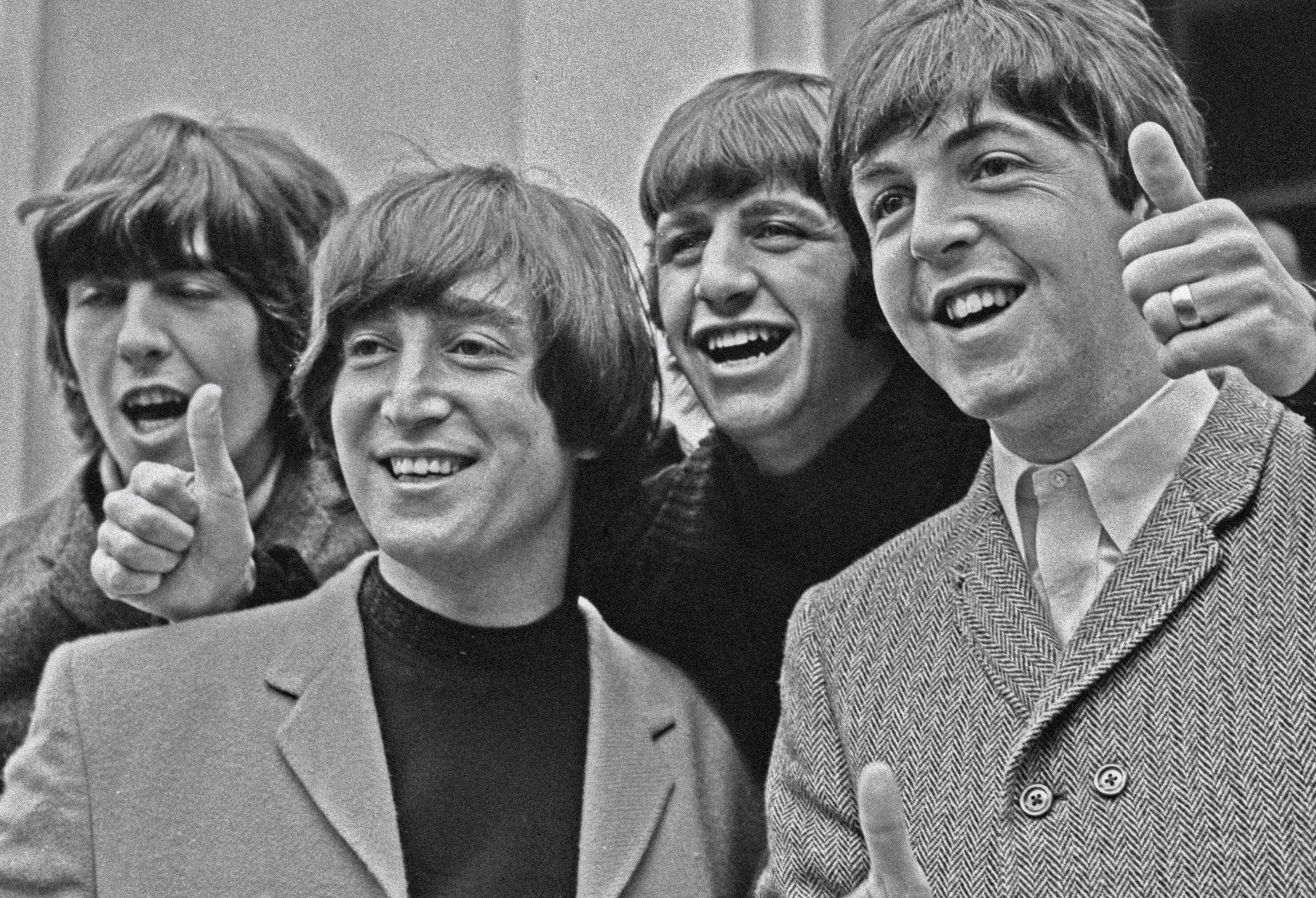 The Beatles in black-and-white during the "Here Comes the Sun"