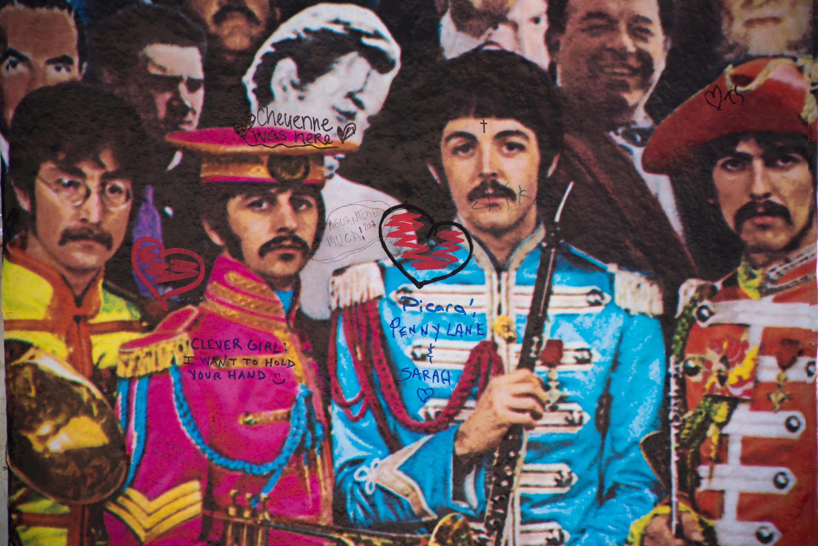Artwork based on The Beatles' 'Sgt. Pepper' with graffiti on it