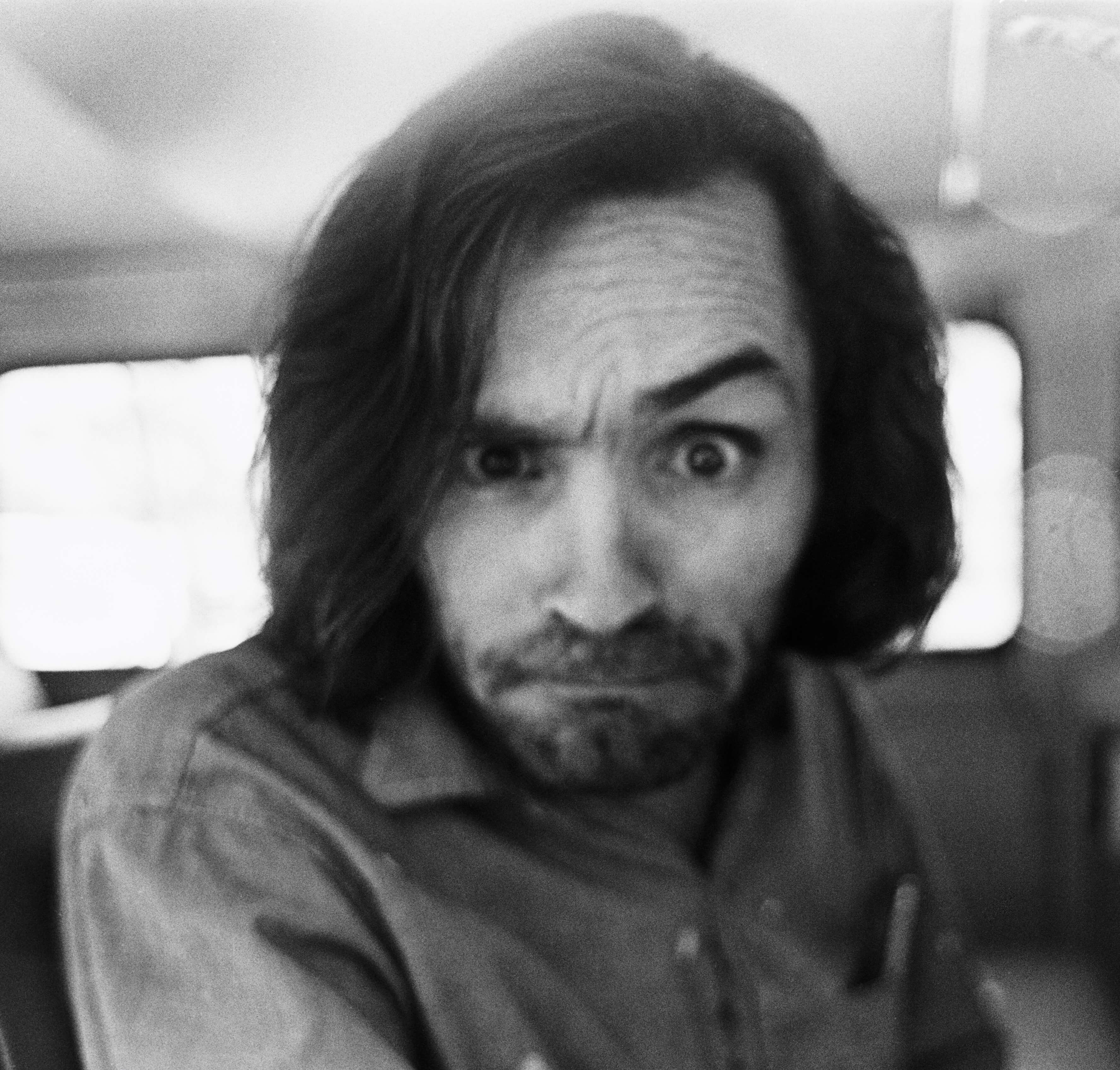 Charles Manson, a criminal inspired by The Beatles' 'The White Album,' in black-and-white
