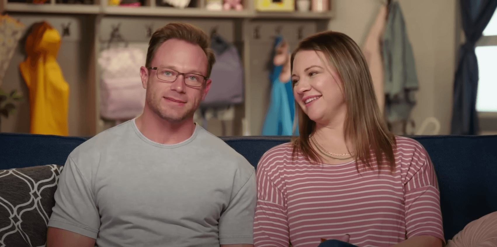 Adam and Danielle Busby sitting next to each other in 'OutDaughtered'