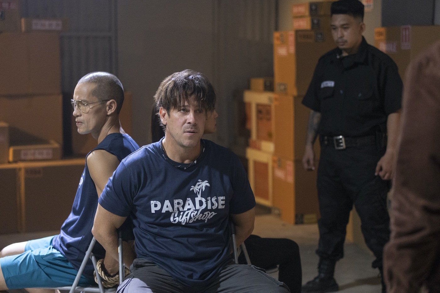 Art Acuña and Christian Kane tied to chairs in 'Almost Paradise'