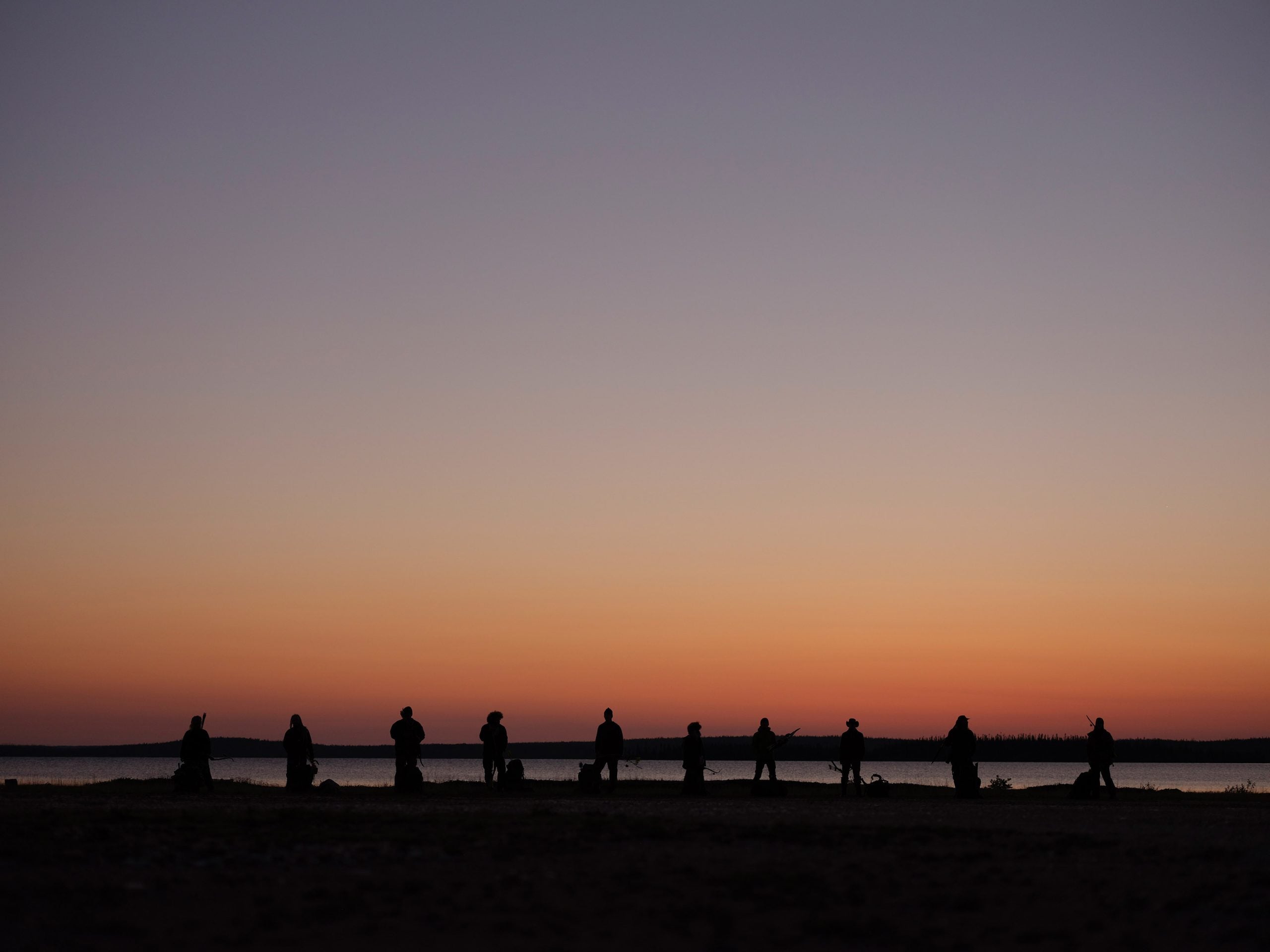 'Alone' Season 10 cast members silhouetted against the sunset