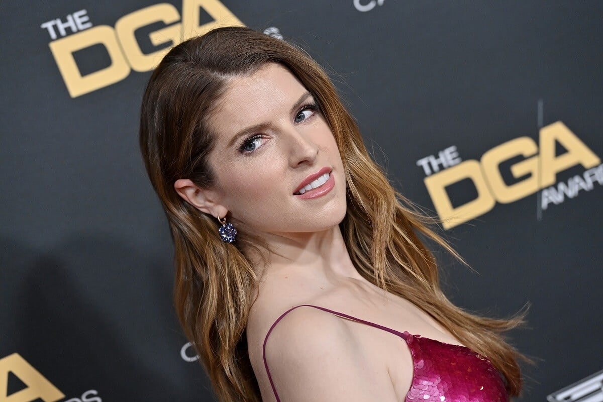Anna Kendrick posing for a picture while wearing a red dress at the 75th Directors Guild of America Awards.