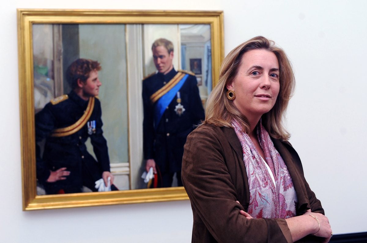Artist Nicky Phillips stands beside a double portrait she painted of Prince William and Prince Harry which was unveiled at the National Portrait Gallery