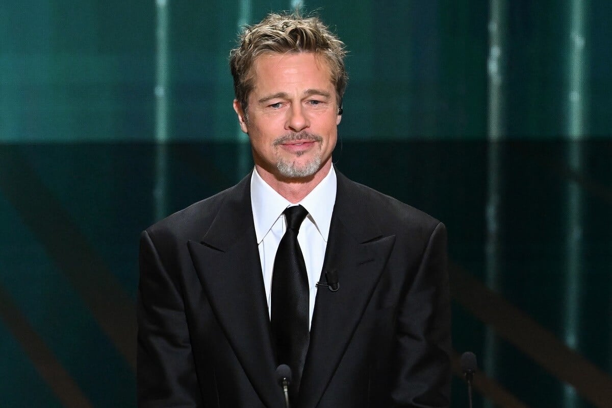 Brad Pitt posing in a suit at the 48th Cesar Film Awards.