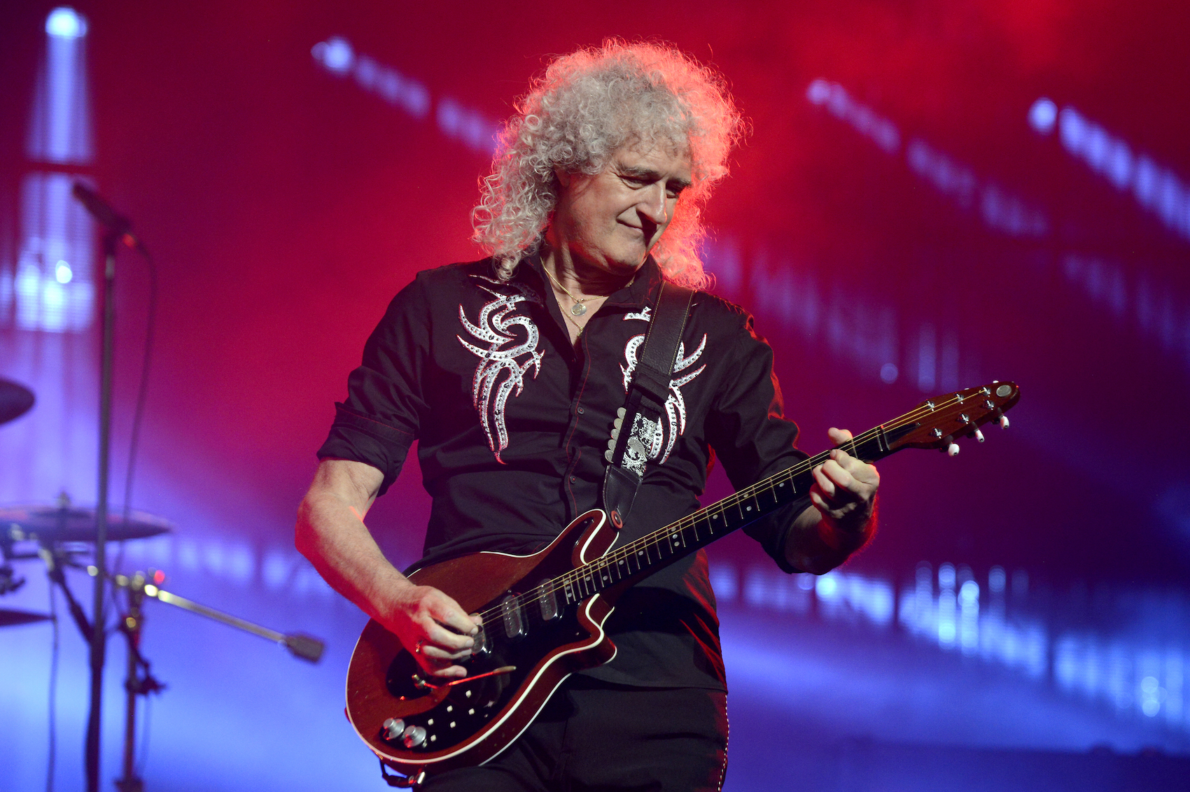 Brian May performs with Queen + Adam Lambert at SAP Center in San Jose, California in 2017