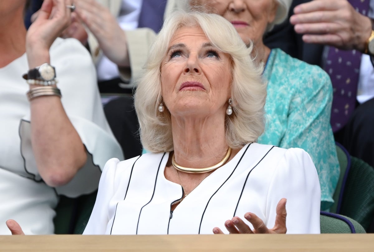 Camilla Parker Bowles (now-Queen Camilla), who a psychic says may have a conflict in the near future, suspected rain during day 10 of the Wimbledon Tennis Championships