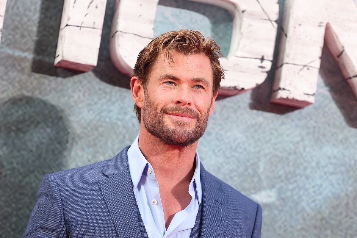 Chris Hemsworth posing at the premiere for 'Extraction 2' while wearing a suit.