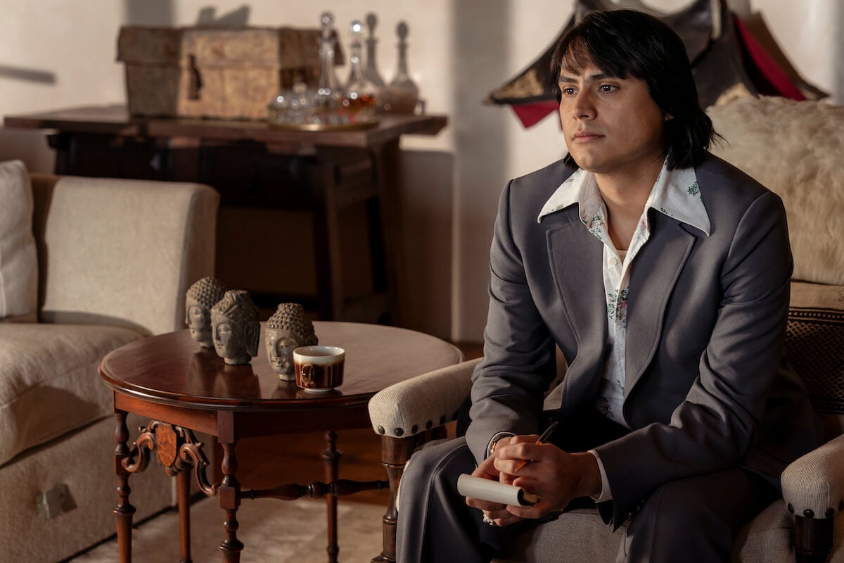 Kiowa Gordon as Jim Chee, dressed in a 1970s polyester suit, in 'Dark Winds' Season 2