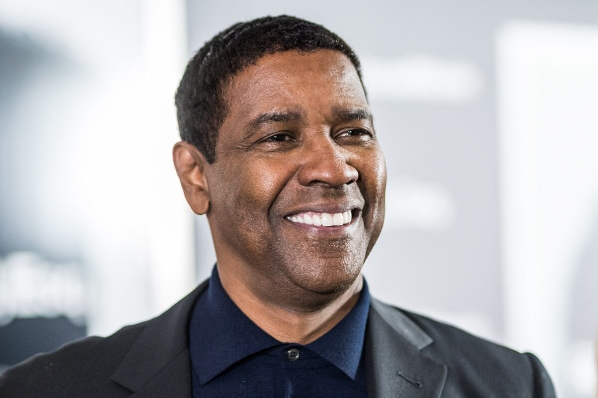 Denzel Washington smiling in a black suit at the Roman J Israel Esquire" New York Premiere.