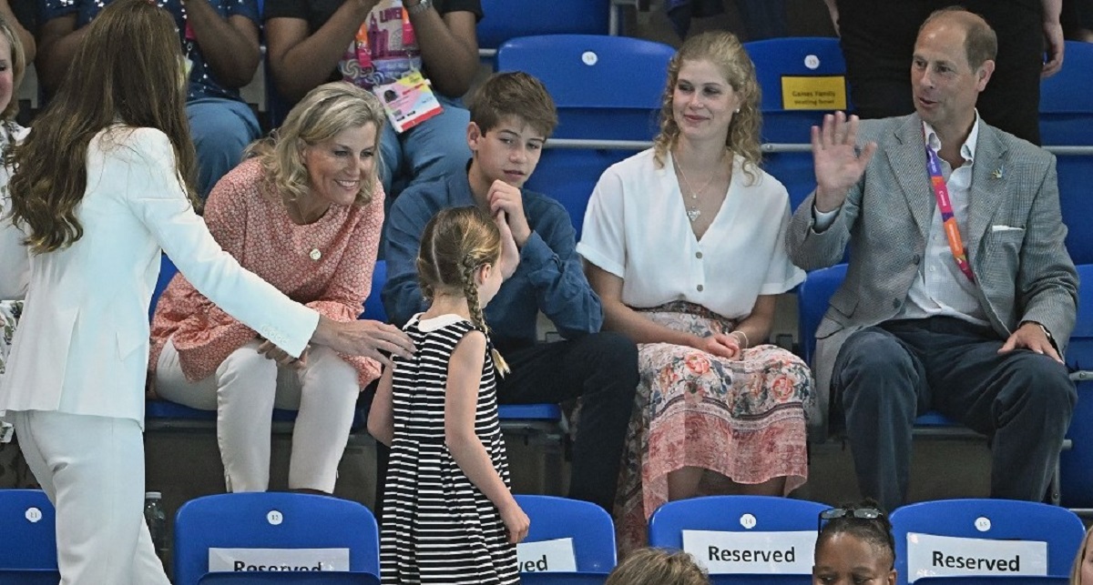 Duchess Sophie leaning forward to greet Princess Charlotte as she arrives watch swimming heats at the Sandwell Aquatics Centre