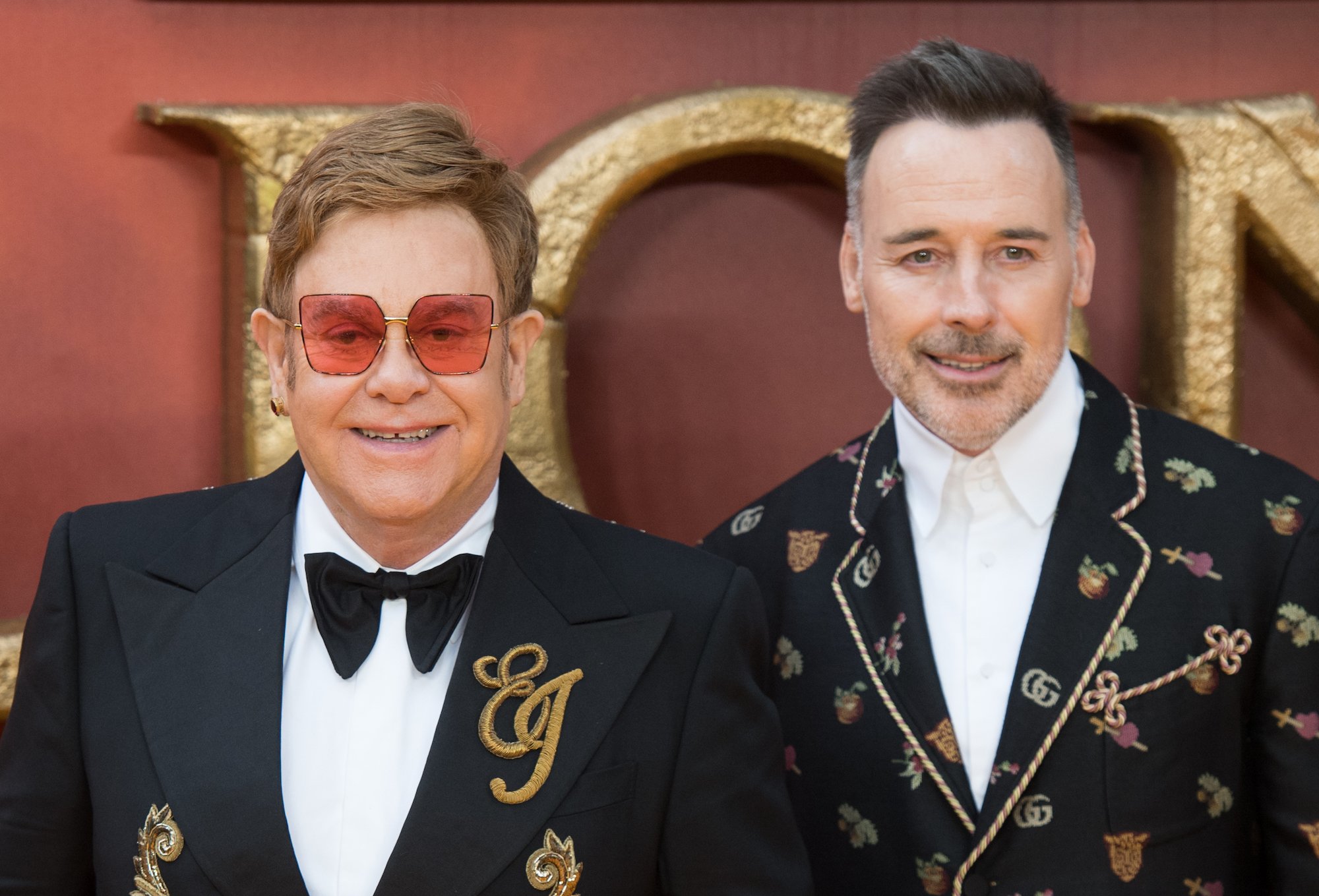 Elton John and husband David Furnish attend The Lion King premiere in London, England
