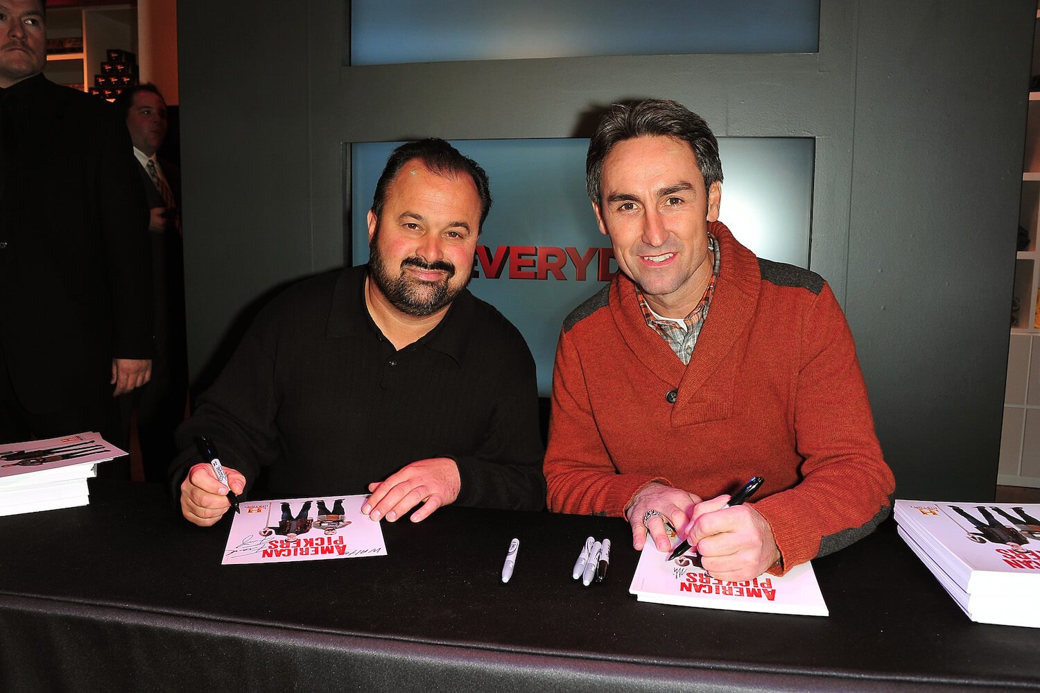 Frank Fritz and Mike Wolfe from 'American Pickers' sitting side by side at a signing