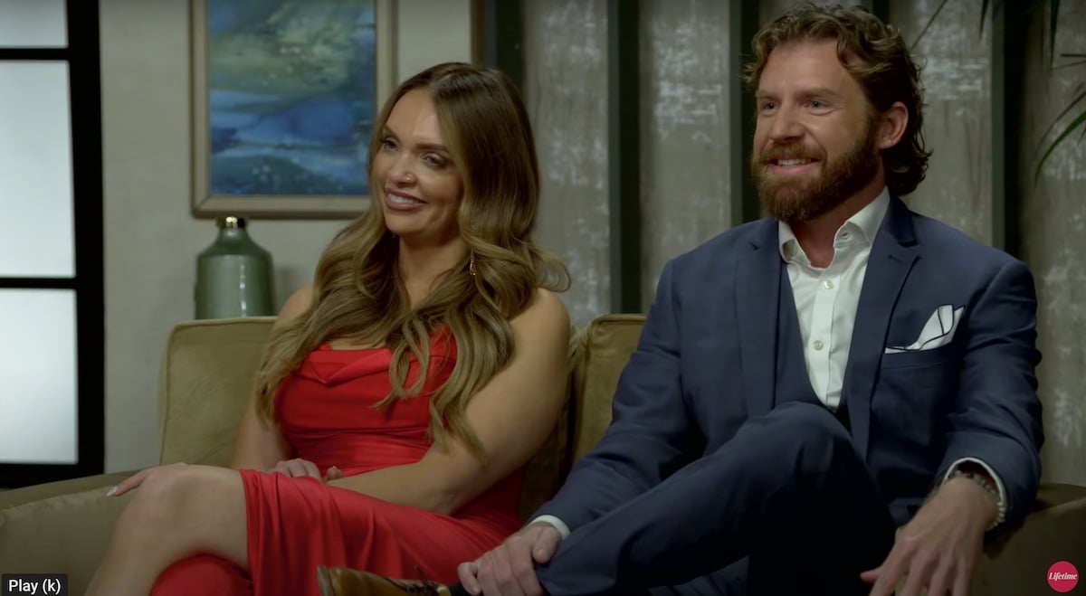 Gina, in a red dress, and Clint, in a blue suit, from 'Married at First Sight' Nashville
